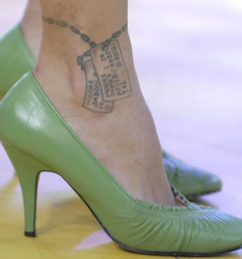 Pinks Dog Tags Tattoo on Her Ankle
