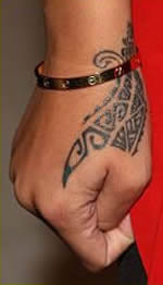 Rihanna’s Tribal Dragon Claw Hand Tattoo