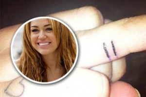 Miley Cyrus equal sign finger tattoo