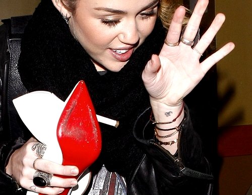Miley Cyrus Om Tattoo on Her Wrist - Meaning & Story of the Hindu Tat