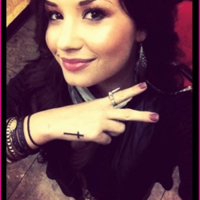 Demi Lovato’s Cross Hand Tattoo