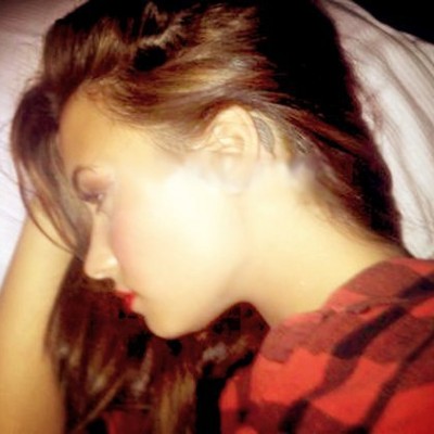 Demi Lovato’s Feather Tattoo Behind Her Ear