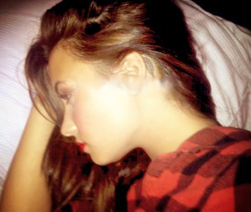 Demi Lovato’s Feather Tattoo Behind Her Ear