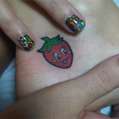 Katie Perry’s Ankle Strawberry Tattoo