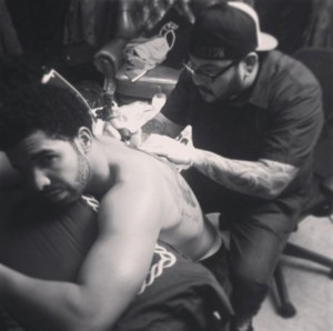 Drake Getting Family Portrait back Tattoo