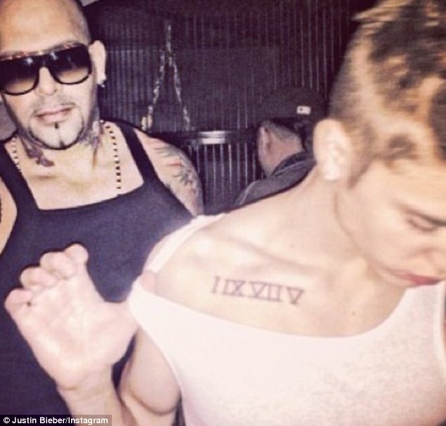 Justin's Roman Numeral Tattoo on His Chest / Shoulder- PopStarTats