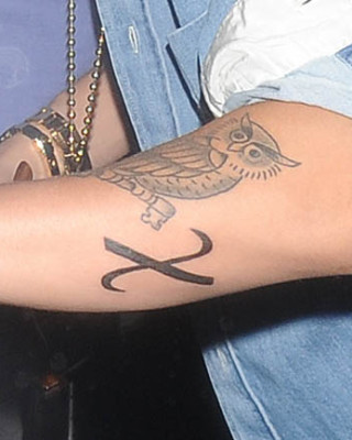Justin Bieber’s “X” Greek Christ Symbol Tattoo on His Arm