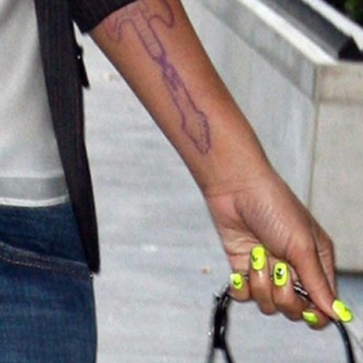 Rihanna Considered Getting a BIG Guitar Tat Back in the Day