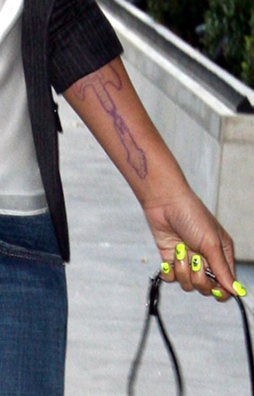 Rihanna Considered Getting a BIG Guitar Tat Back in the Day