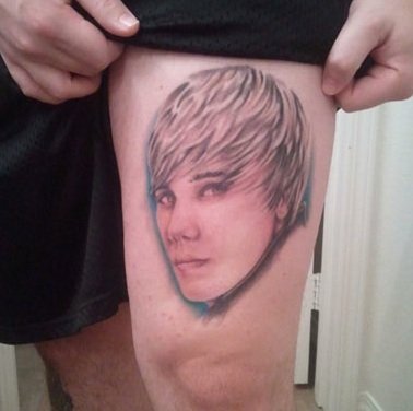 This Guy Got Justin Bieber’s Face Tattooed on His Leg