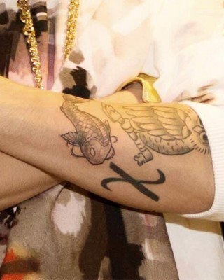 Justin Bieber’s Koi Fish Tattoo on His Arm