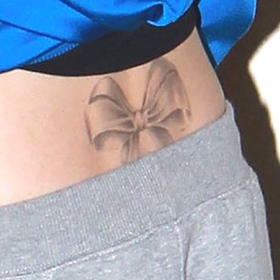 Cher Lloyd’s Large Bow Back Tattoo