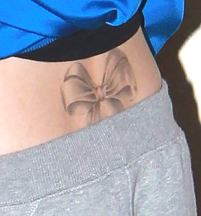 Cher Lloyd's Large Bow Back Tattoo- PopStarTats
