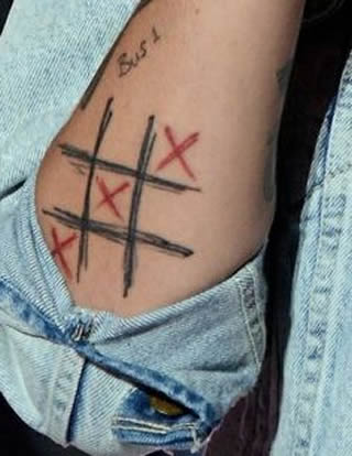 Louis Tomlinson's Playing Card Suits and Tic-Tac-Toe Tattoos- PopStarTats