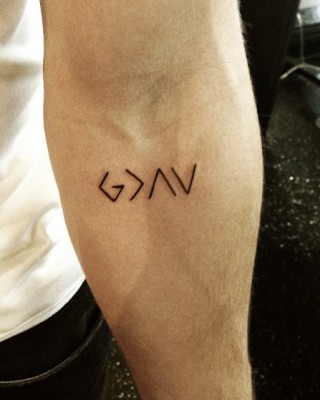 Nick Jonas Reveals New Religious Arm Tattoo