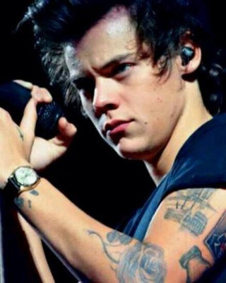 Harry Styles’ New Fancy Skull in a Top Hat Tattoo on His Arm