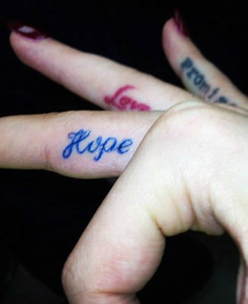 Rita Ora's Blue “Hope” Finger Tattoo- PopStarTats