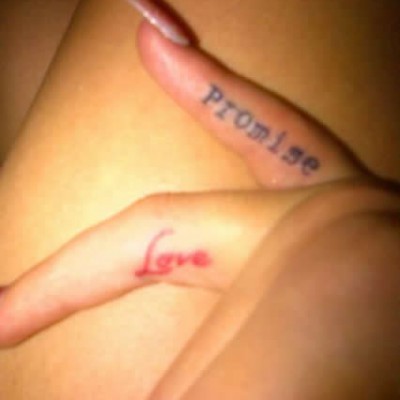 Rita Ora’s Red “Love” Tat on Her Ring Finger