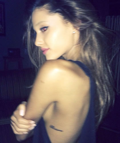 Ariana Grande Gets “Bellissima” Side Tattoo as Tribute to Grandfather