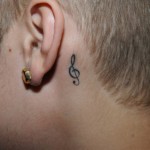 justin-bieber-jail-photos-ear-tattoo