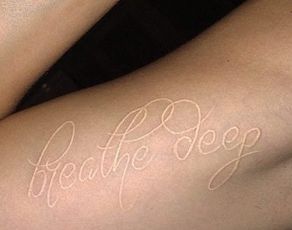 cara-delevingne-breathe-deep-tattoo