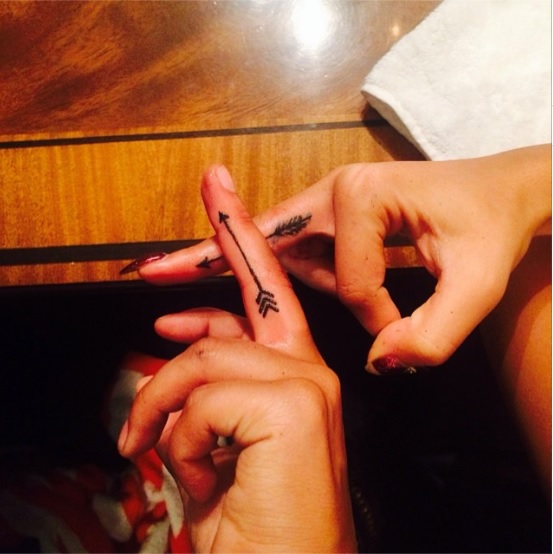 Rita Ora Debuts Simple Finger Tattoo of a Black Arrow