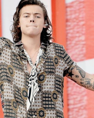 Harry Styles Debuts New “You Booze You Lose” Arm Tattoo