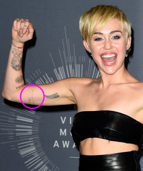 Miley Cyrus' “I'm In Your Corner” Johnny Cash Tattoo on Her Bicep-  PopStarTats
