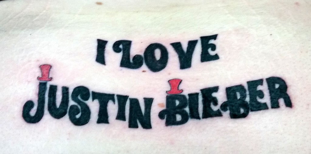 Jamie Young has Justin Beiber tattoo on his back at Apollo Tattoo, Leigh.