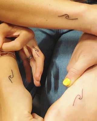 Miley Cyrus’ Matching Tattoo with Chris Hemsworth’s Wife Was Designed by Kelly Slater