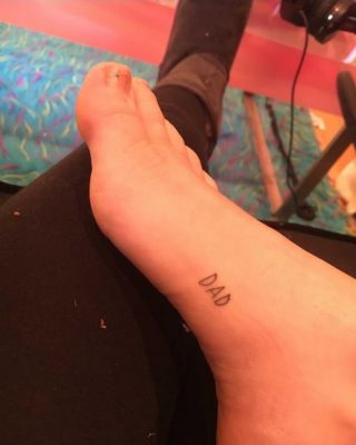Miley Cyrus Honors Father With “DAD” Foot Tattoo