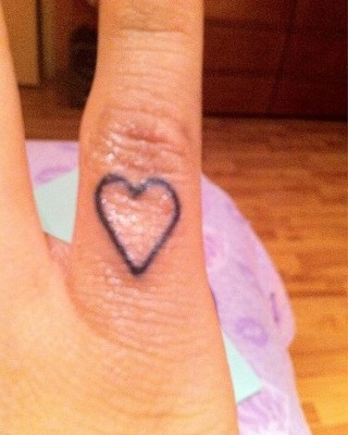 Miley Cyrus Heart Finger Tattoo