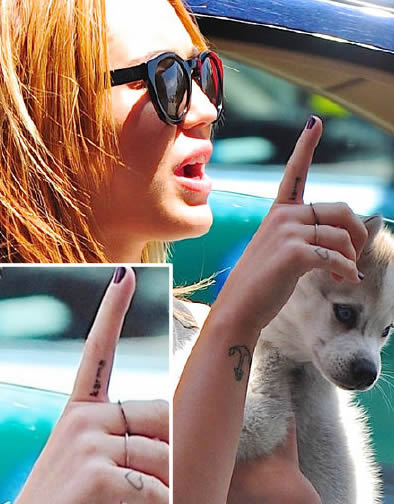 Miley Cyrus’ Karma Tattoo