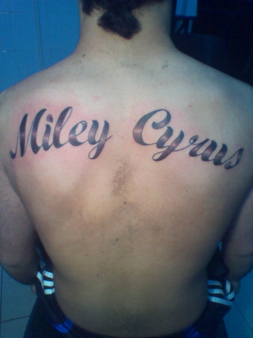 Dude Got “Miley Cyrus” Tattooed on His Back