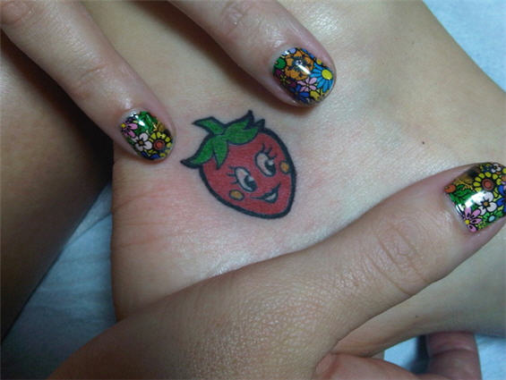 Katie Perry’s Ankle Strawberry Tattoo