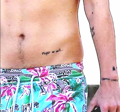 Harry Styles’ “Might as Well…” Tattoo on His Waist