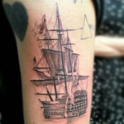 Harry Styles’ Ship, Pink Floyd, and “Home Made” Tattoos on His Arm