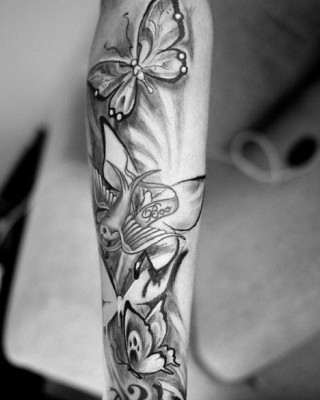 Cher’s Lloyd’s Large Butterflies Arm Tattoo