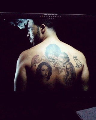 Who’s That on Your Back?? Drake Finally Reveals Mysterious Portrait Back Tattoo