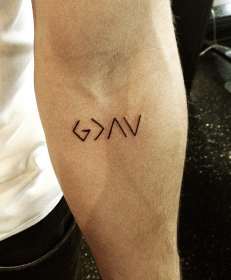 Nick Jonas Reveals New Religious Arm Tattoo