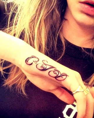 Cara Delevingne’s “CJD” Initials Tattoo on Her Hand