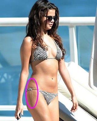 Selena Gomez Accidentally Flashes Sexy “God strenthens me” Hip Tattoo