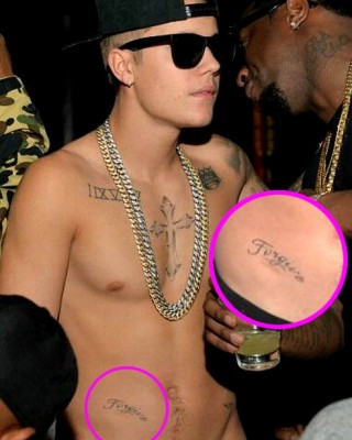 Shirtless Justin Bieber Shows Off New “Forgive” Hip Tattoo at Diddy Party
