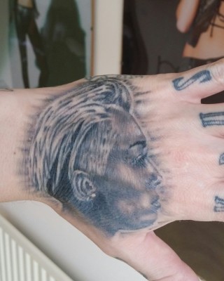 Miley Cyrus Fanatic Carl McCoid Debuts New Portrait Tat on His Hand, Making 23 Miley Tats