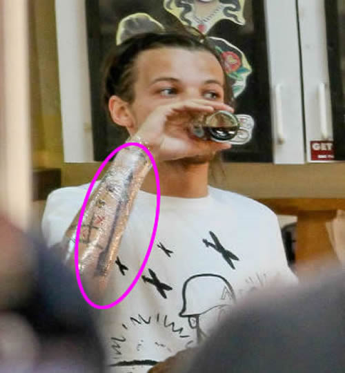 Louis Tomlinson Adds a Large Arrow Tattoo to His Growing Sleeve
