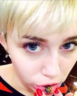 Miley Cyrus Gets Bizarre “Sad Kitty” Tattoo Inside Her Lip