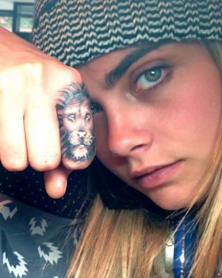 Cara Delevingne’s “Breathe Deep” Tat Keeps Her from Punching Paparazzi