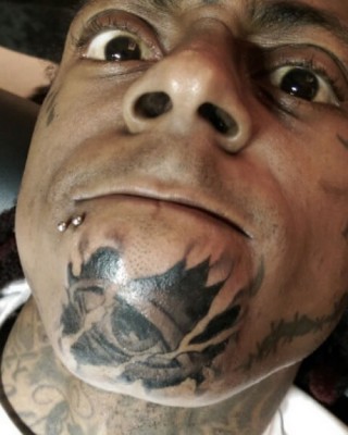 Lil Wayne Visits Tattoo Artist “Spider,” Adds Even More Ink to His Face