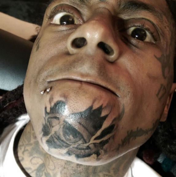 Lil Wayne Visits Tattoo Artist “Spider,” Adds Even More Ink to His Face