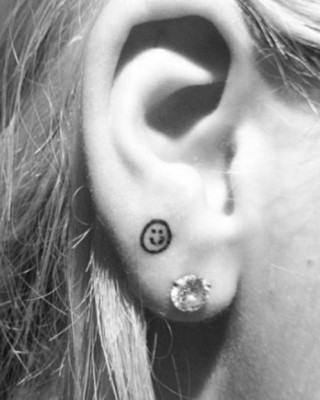 Rita Ora Shows Off New Smiley Face Earlobe Tattoo Following The Voice UK Debut